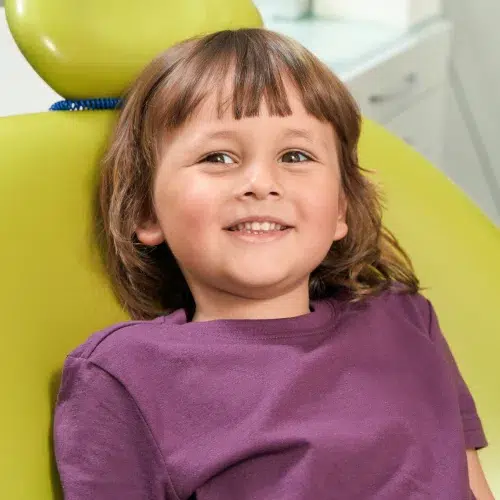 Happy child relaxed in a dental chair at Long Island Pediatric Dentistry in Lawrence, NY