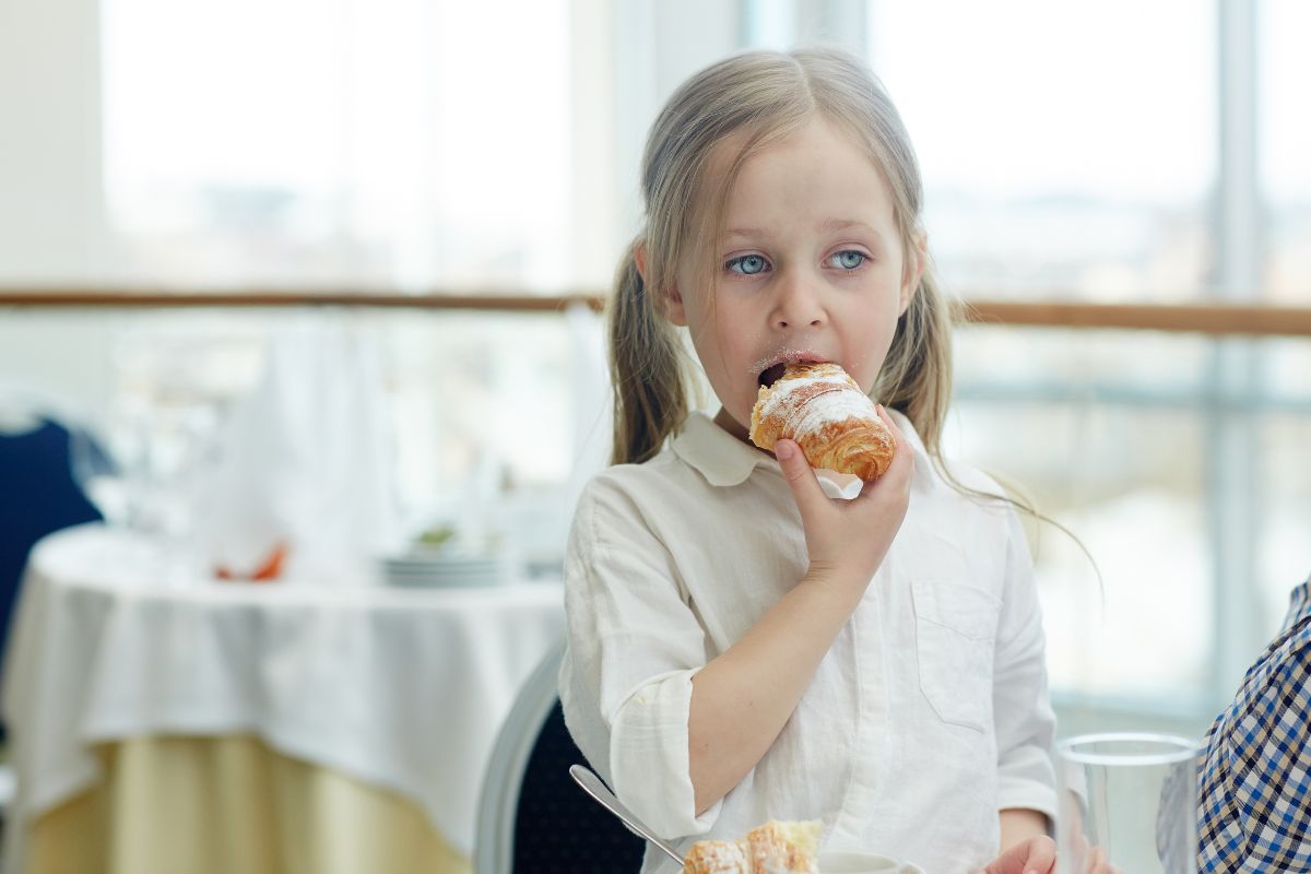 Child eating soft food while experiencing tooth pain